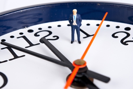 miniature man on the clockの写真素材