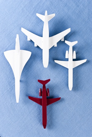some airplanes in one roe on blue backgroundの写真素材
