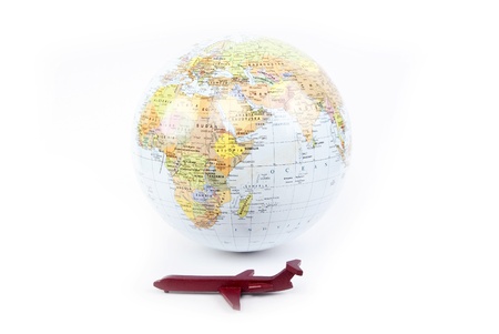 globe with red plane in oneの写真素材