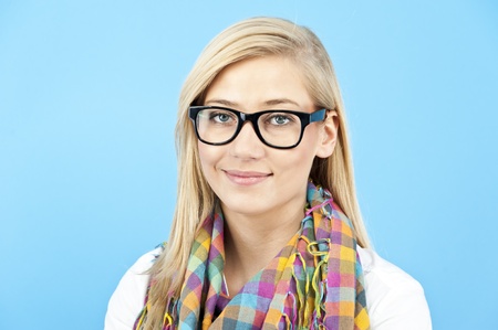 young woman on blue backgroundの写真素材