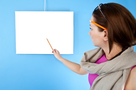 woman holding a blank board and pointingの写真素材