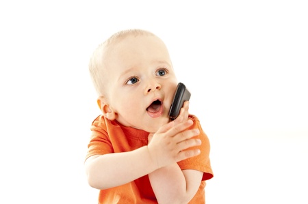 baby talking by mobile phoneの写真素材