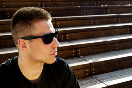 man on the stairs with sunglassesの写真素材