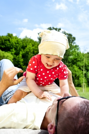 father play's with his baby girlの写真素材