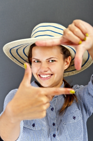 Teenager girl photo frame by the handsの写真素材