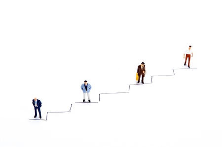 Miniature people on white backgroundの写真素材