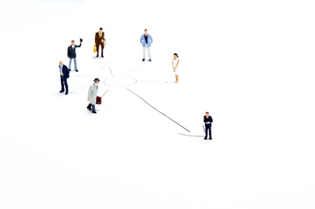 Miniature people on white backgroundの写真素材
