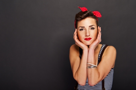 Pin-up woman with big smile on black backgroundの写真素材