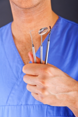 Dentist doctor over dark backgroundの写真素材