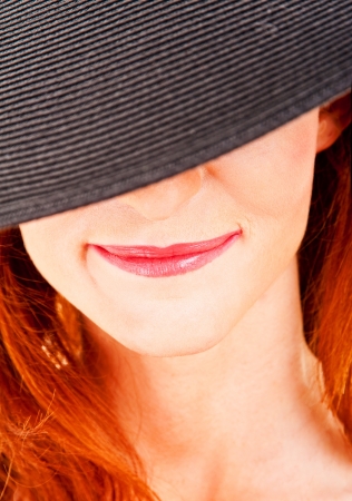 Fashion delightful woman in a white hat, close-upの写真素材
