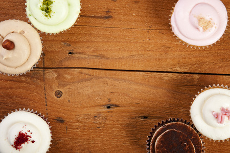 cupcakes on wooden backgroundの写真素材