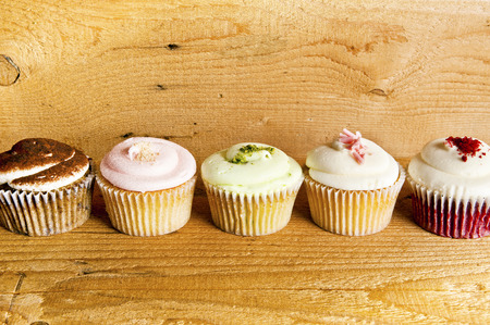 cupcakes on wooden backgroundの写真素材