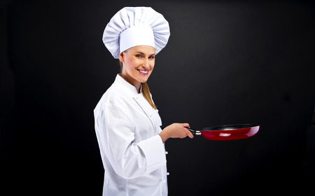 young woman chef with different tools on whiteの写真素材