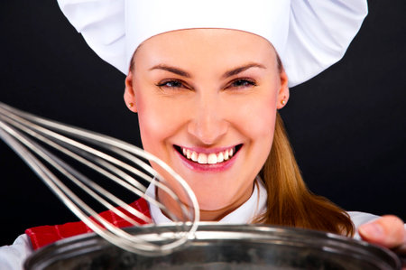 cooking and food concept - smiling female chef with pot and other toolsの写真素材