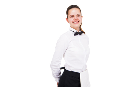 Young woman in waiter uniform isolated over white background.の写真素材