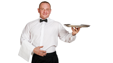 Waiter holding tray. isolated over white background.の写真素材