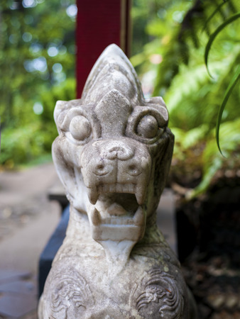 Asian stone dragon in garden.の写真素材