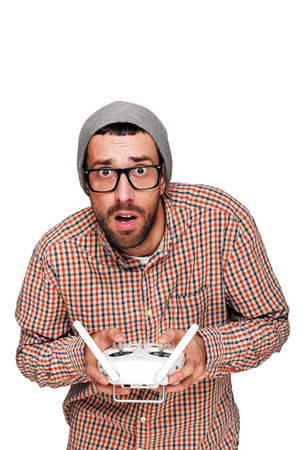 Man with flying drone. Studio shot on white background, isolated