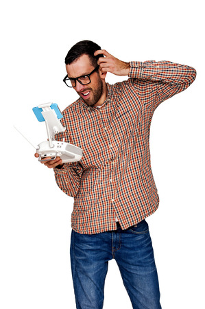 Man with flying drone. Problem. Studio shot on white background, isolated