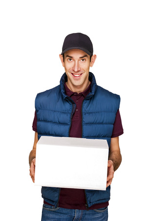 Delivery man with boxes isolated over white background.の写真素材
