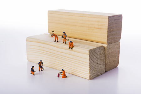 Miniature people workers occupation isolate on white background. Industrial and construction conceptの写真素材