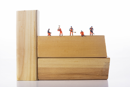 Miniature people workers occupation isolate on white background. Industrial and construction conceptの写真素材