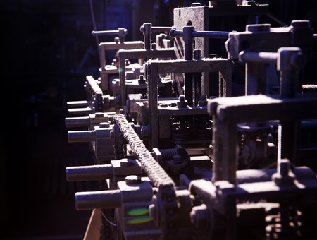 Focus on detail of complex machine silhouette in dirt and dustの写真素材