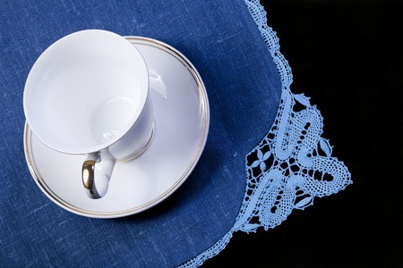 cup on doily with laceの写真素材