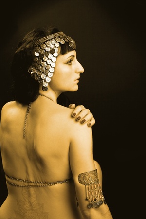 woman as a princess of Egypt in gold costumeの写真素材