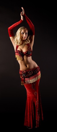 Beauty girl dance in arabic costume in darkの写真素材