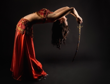 Brunette woman dance with saberの写真素材