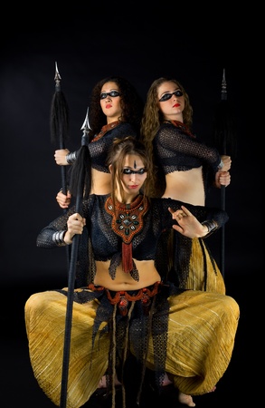 Three woman with spear - traditional arabia costumeの写真素材