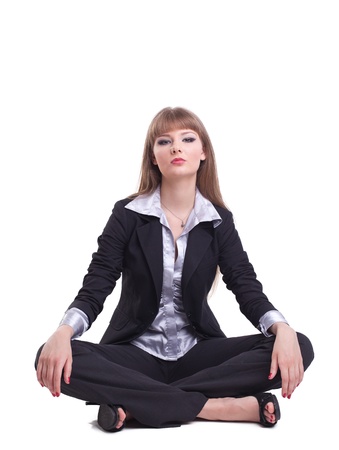 young tall business woman relax in yoga asana isolatedの写真素材