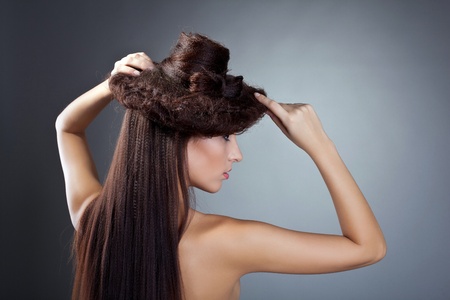 Attractive cute naked beauty woman posing with hair style hat の写真素材
