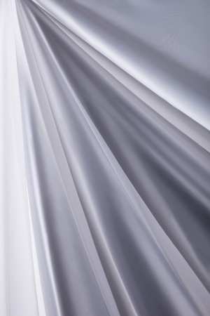 white transparent silk cloth waves background texture close-upの写真素材