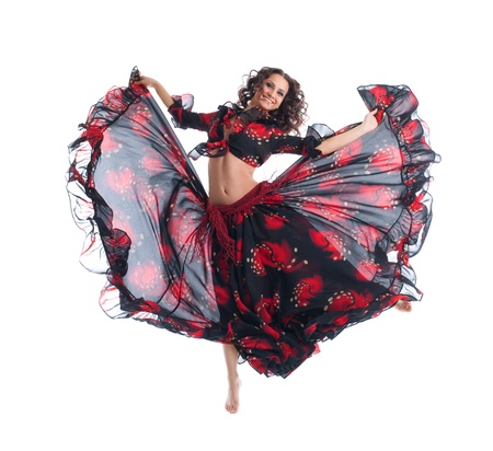 young Beauty woman jump in gypsy dance isolatedの写真素材