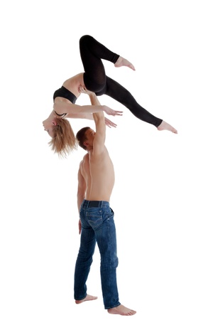 Couple of young gymnast show acrobatic performance isolatedの写真素材