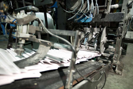 ready newspaper on production line in a print shop