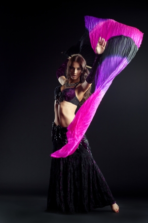 Full length portrait of oriental dancer with shawlの写真素材