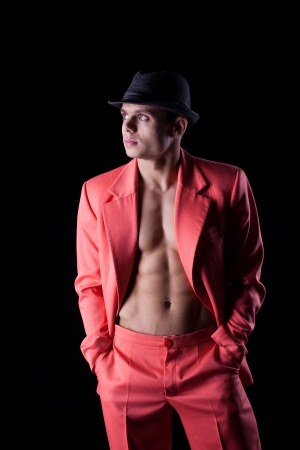 Studio portrait of sexy man in red suitの写真素材