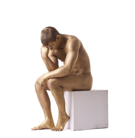 Strong man posing nude studio portrait isolatedの写真素材