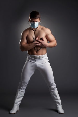 Sexy dancer in white doctor costume  Studio portraitの写真素材