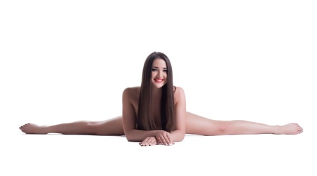 Beautiful young naked woman doing split isolatedの写真素材