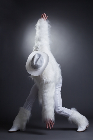 Studio portrait of sexy dancer in white cowboy costumeの写真素材