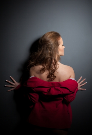 Studio portrait of young woman in pink jacketの写真素材