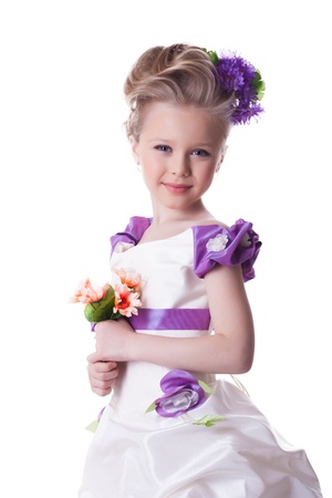 beautiful smiling girl with bouquet of flowers isolated on whiteの写真素材