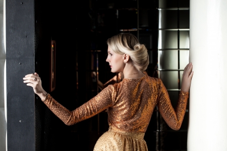Profile of young blonde with beautiful hairstyle, close-upの写真素材