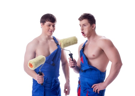 Image of cheerful painters posing in studio on white backgroundの写真素材