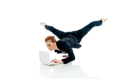 Concept of busyness - entrepreneur posing with PC isolated on whiteの写真素材