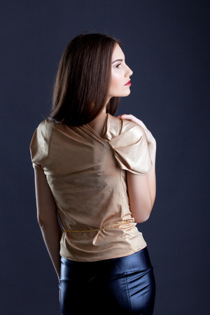 Profile of sensual young woman posing in studio, close-upの写真素材